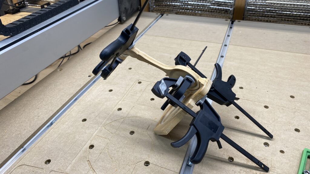 The spoon assembly is glued to the base using creative clamping.