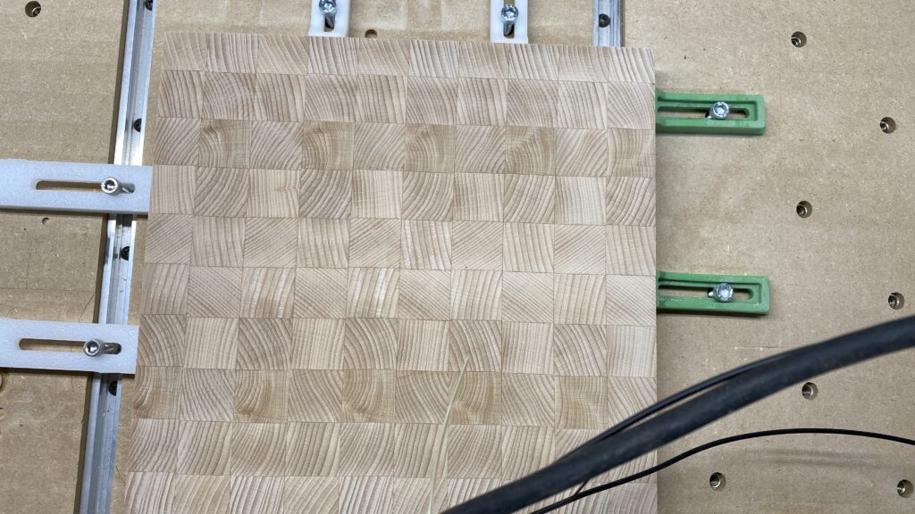 Cutting board mounted to spoil board.
